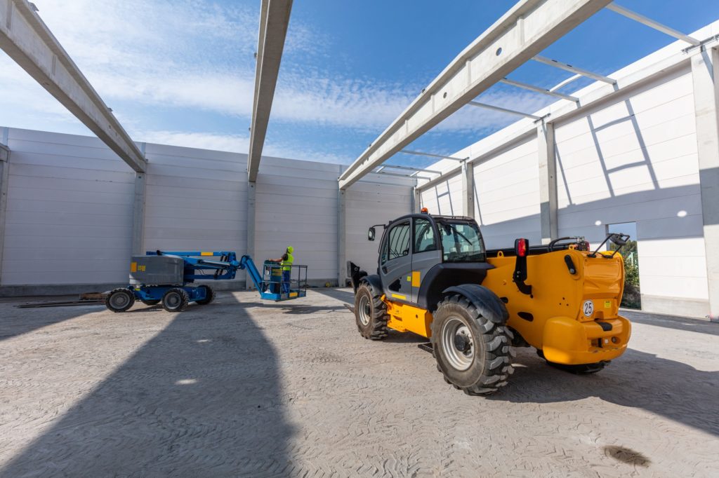Warehouse construction with industrial vehicles.